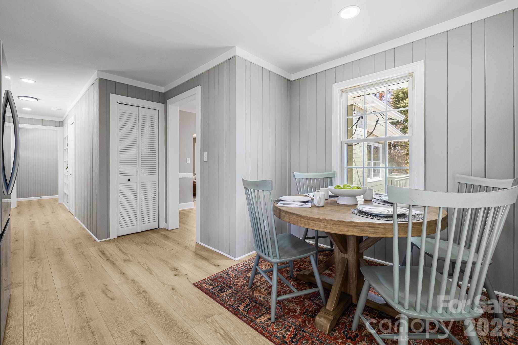 107 Balsam Road Hendersonville, NC 28792 - Photo 10 of 44 a view of a dining room with furniture window and wooden floor