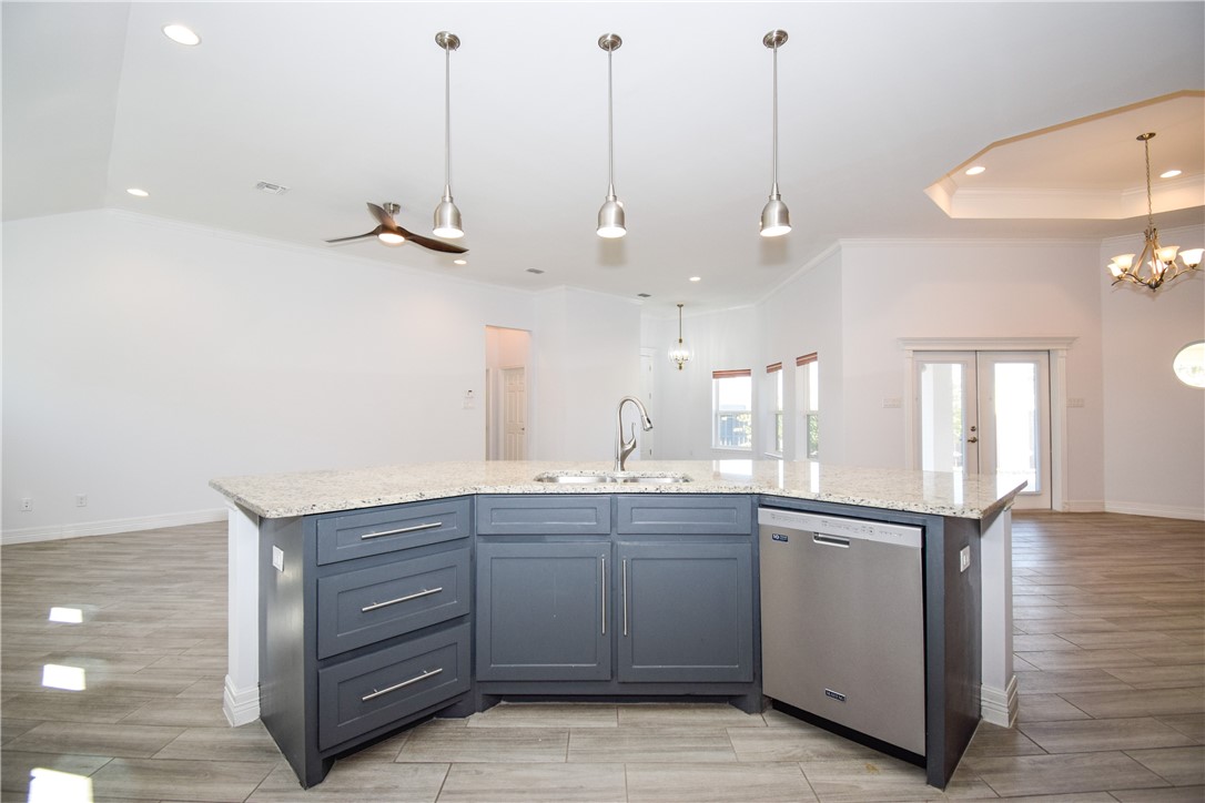 16026 Cuttysark Street Corpus Christi, TX 78418 - Photo 11 of 37 a kitchen with a sink and cabinets