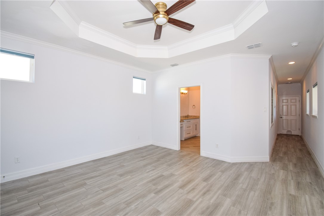 16026 Cuttysark Street Corpus Christi, TX 78418 - Photo 13 of 37 a view of an empty room with wooden floor
