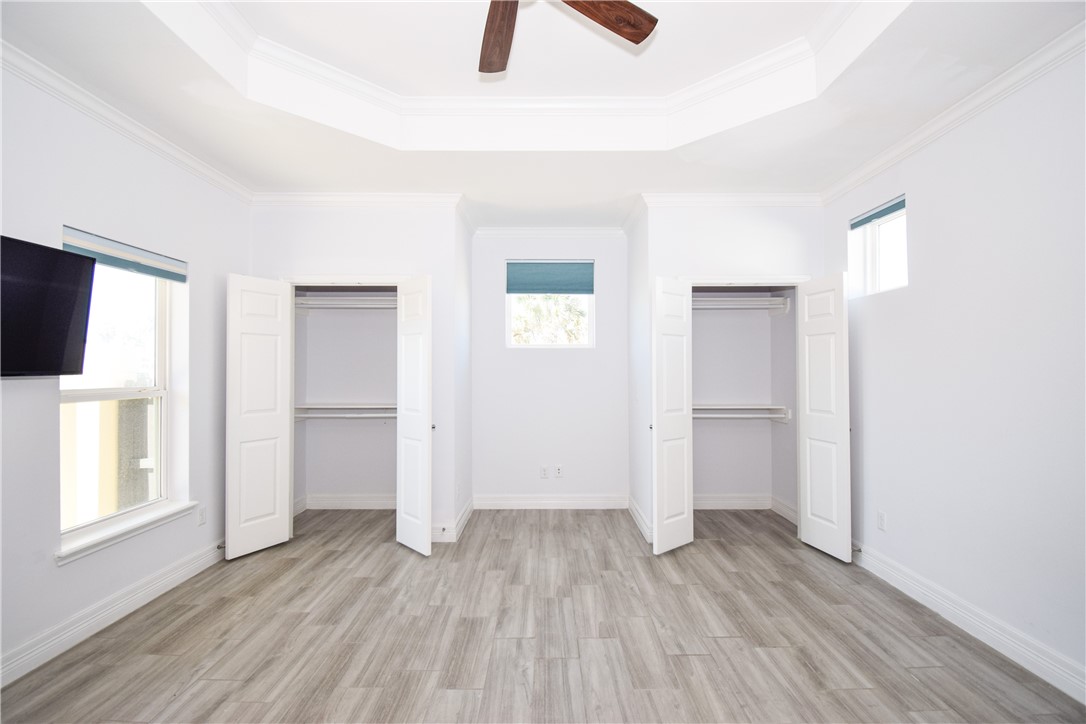 16026 Cuttysark Street Corpus Christi, TX 78418 - Photo 16 of 37 an empty room with closet and windows