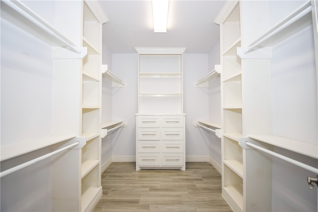 16026 Cuttysark Street Corpus Christi, TX 78418 - Photo 17 of 37 a view of walk in closet with empty racks