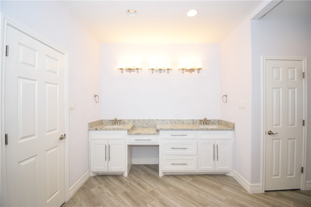 16026 Cuttysark Street Corpus Christi, TX 78418 - Photo 19 of 37 a view of cabinets with wooden floor