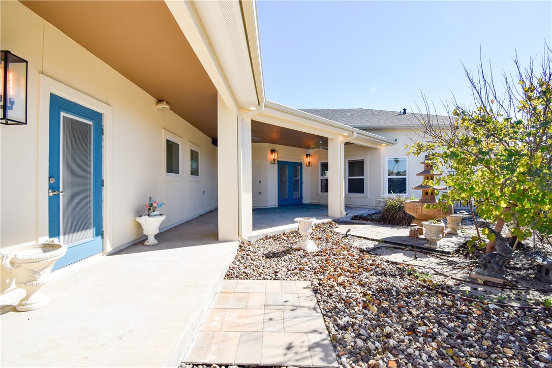 16026 Cuttysark Street Corpus Christi, TX 78418 - Photo 34 of 37 a bedroom with a bed and a potted plant