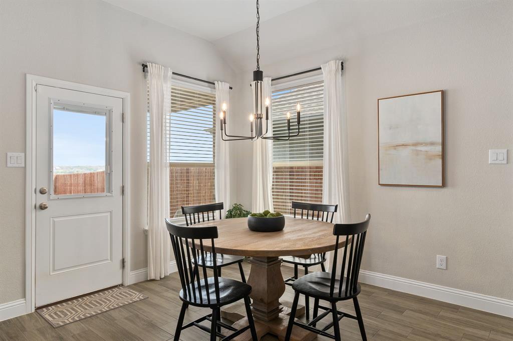 1125 Knightsbridge Road Argyle, TX 76226 - Photo 5 of 27 a dining room with furniture and wooden floor