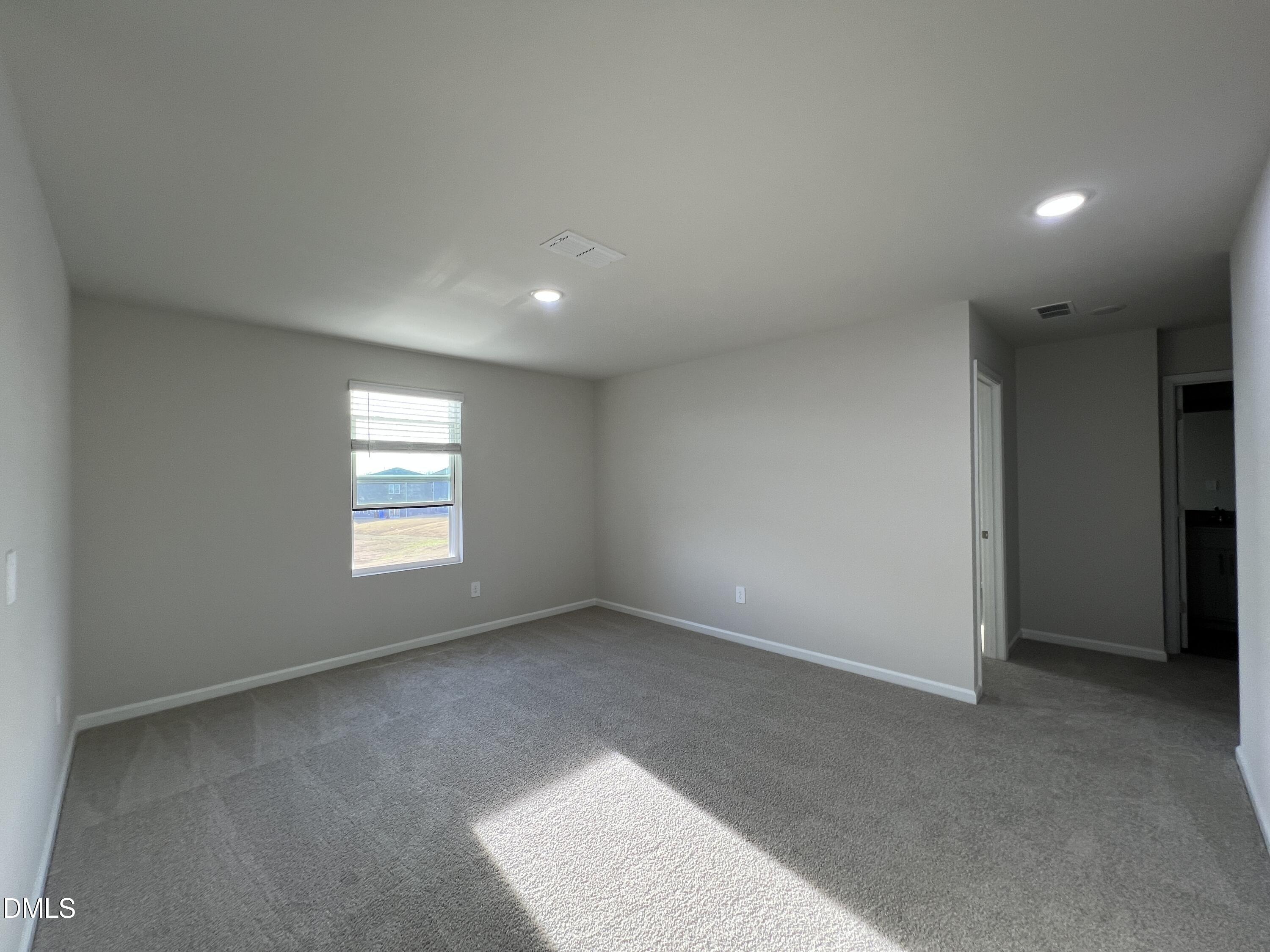 212 Thistle Patch Place Angier, NC 27501 - Photo 13 of 32 a view of an empty room with a window