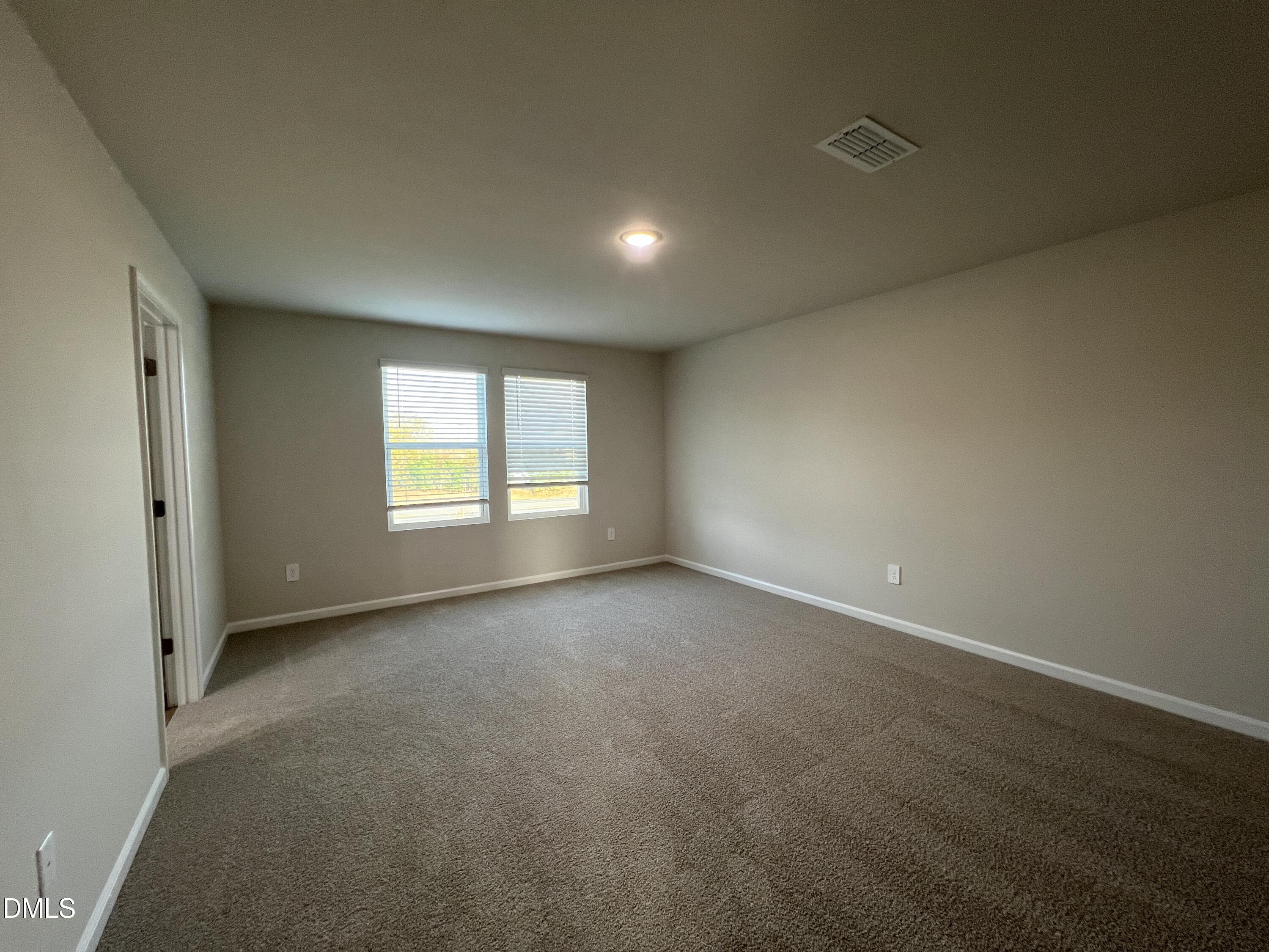212 Thistle Patch Place Angier, NC 27501 - Photo 15 of 32 an empty room with windows