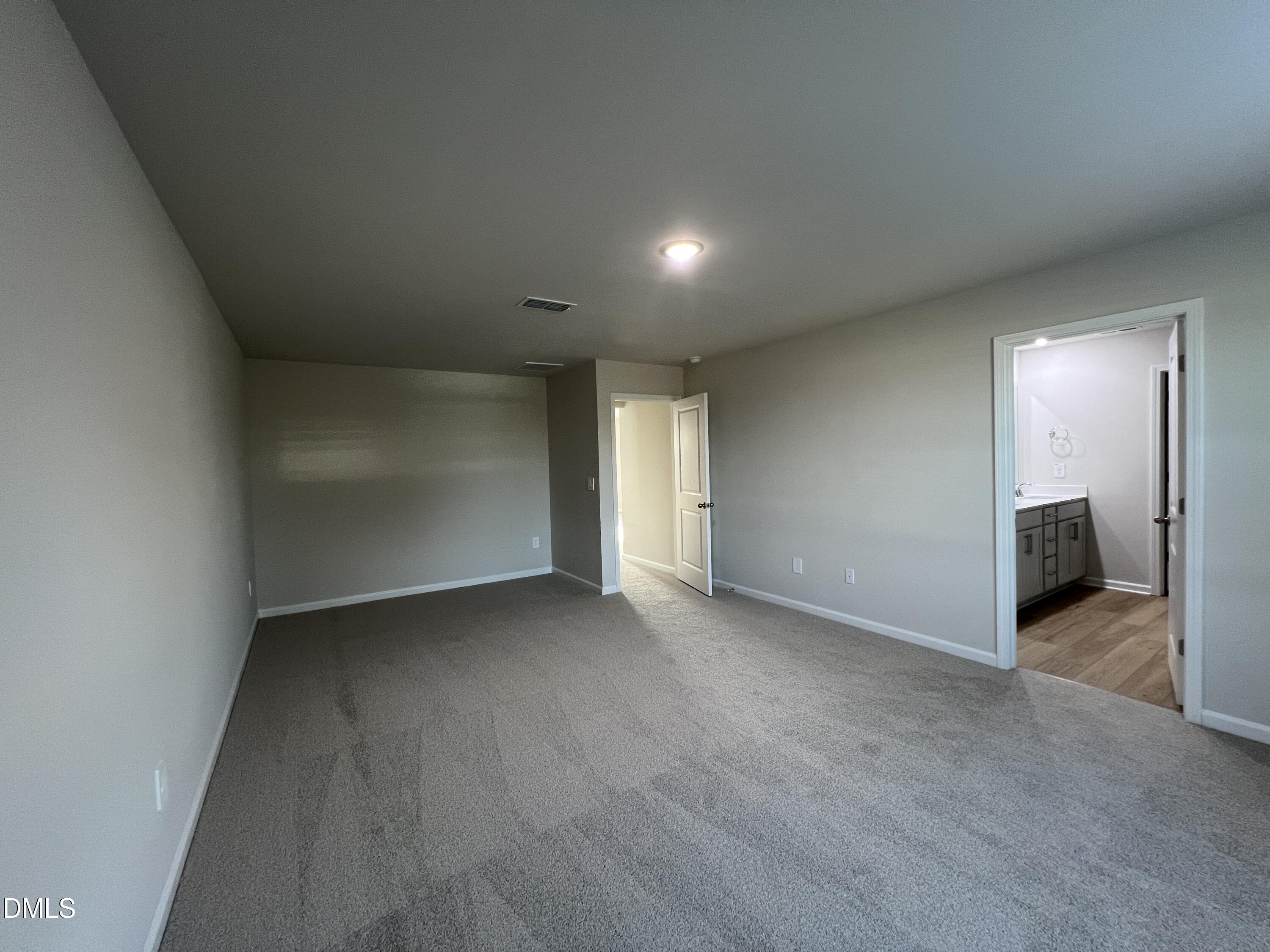 212 Thistle Patch Place Angier, NC 27501 - Photo 16 of 32 an empty room with a bathroom