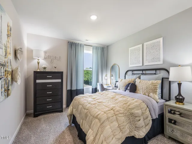 a bedroom with a bed and window