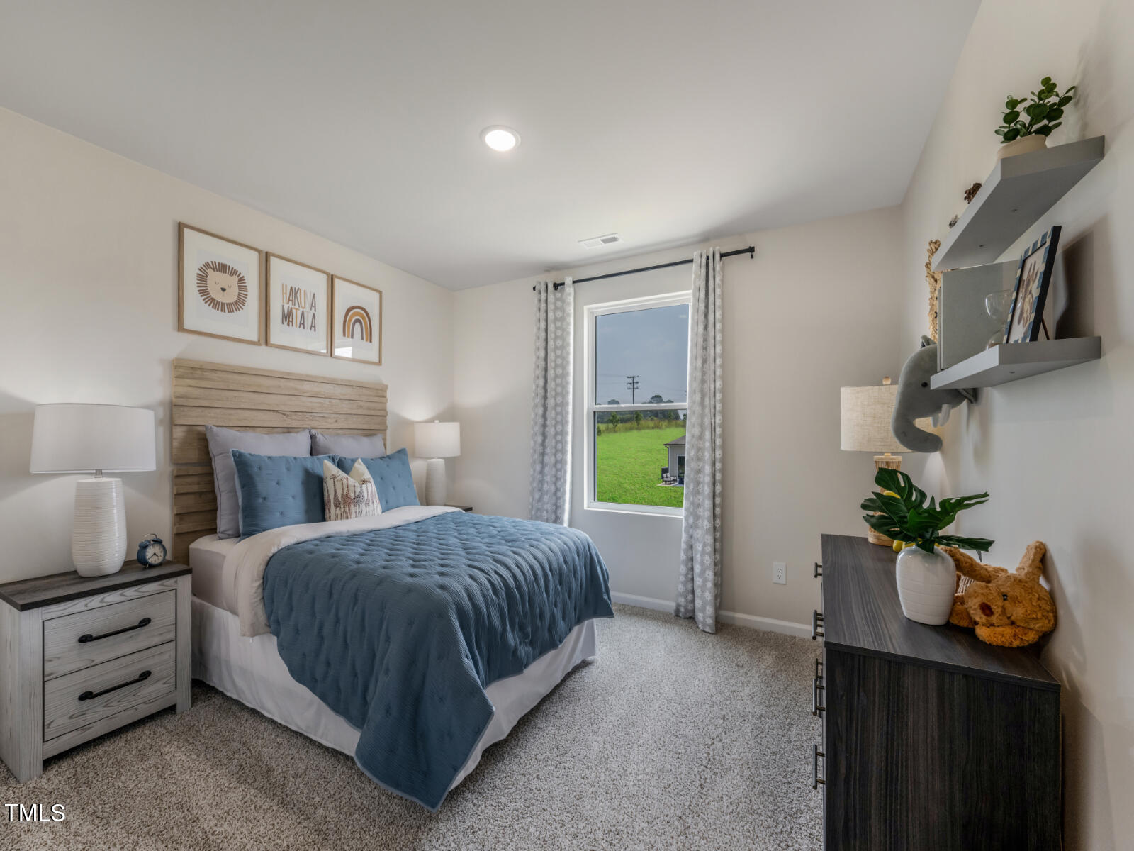 212 Thistle Patch Place Angier, NC 27501 - Photo 27 of 32 a bedroom with a bed and a potted plant