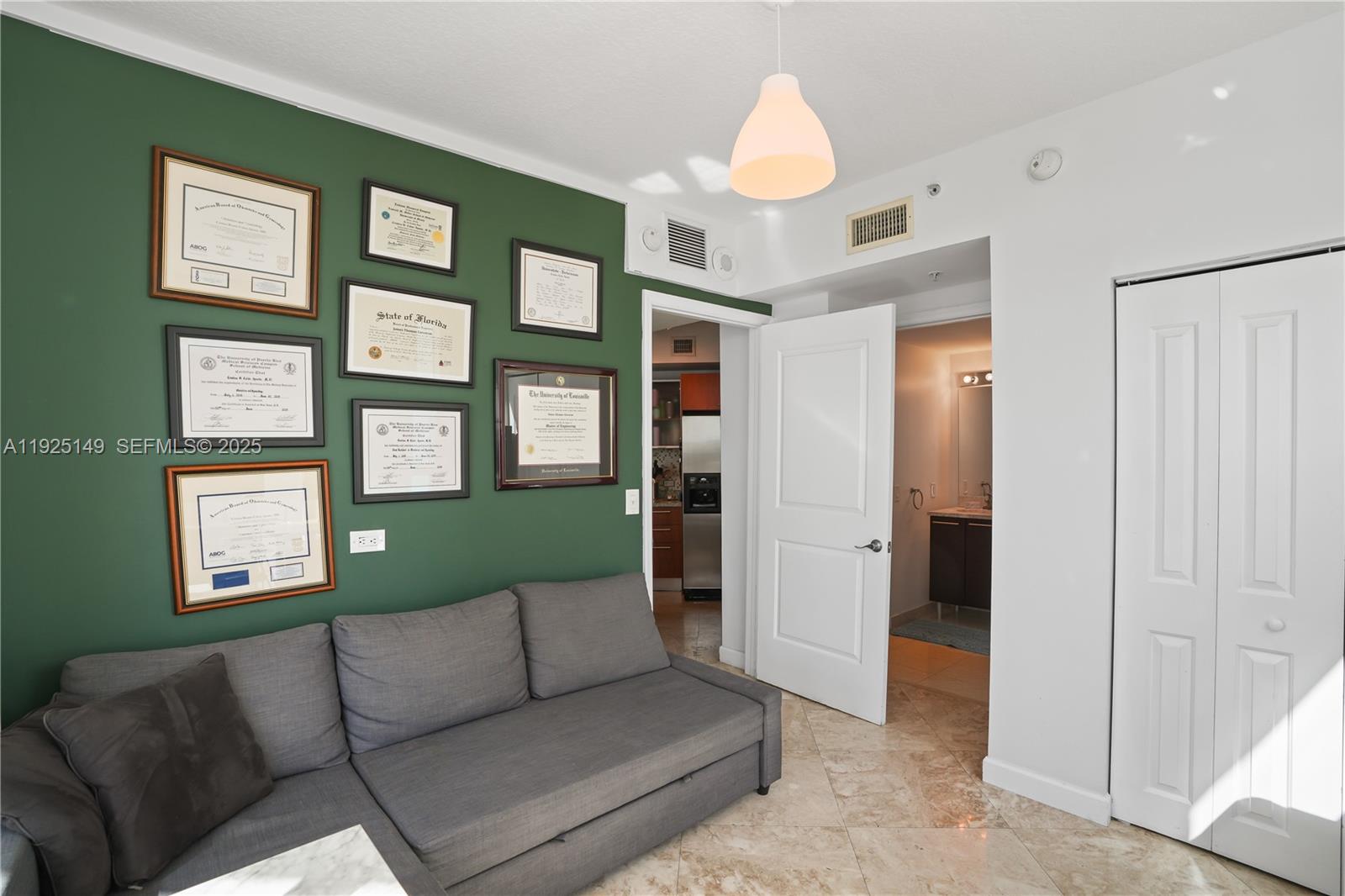 480 Northeast 30th Street, Unit 703 Miami, FL 33137 - Photo 21 of 31 a living room with furniture and a window