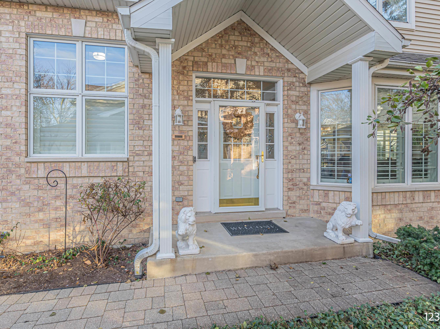 1754 Park Ridge Point, Unit 1754 Park Ridge, IL 60068 - Photo 2 of 39 a front view of a house with a yard