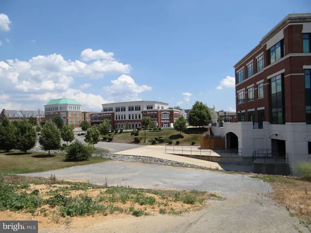 a view of a street with a building in the background