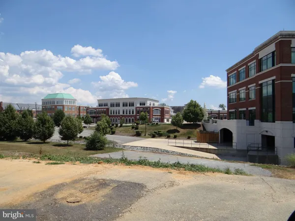a view of a street with a building in the background