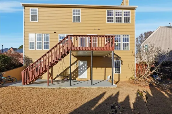 a view of a house with wooden stairs