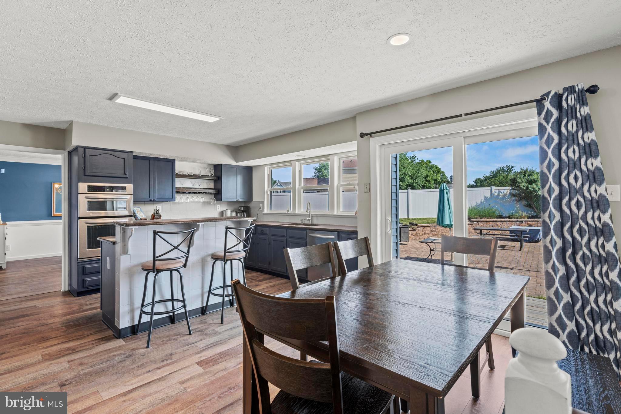 181 Aberdeen Road Williamstown, NJ 08094 - Photo 12 of 29 a dining room with furniture and wooden floor