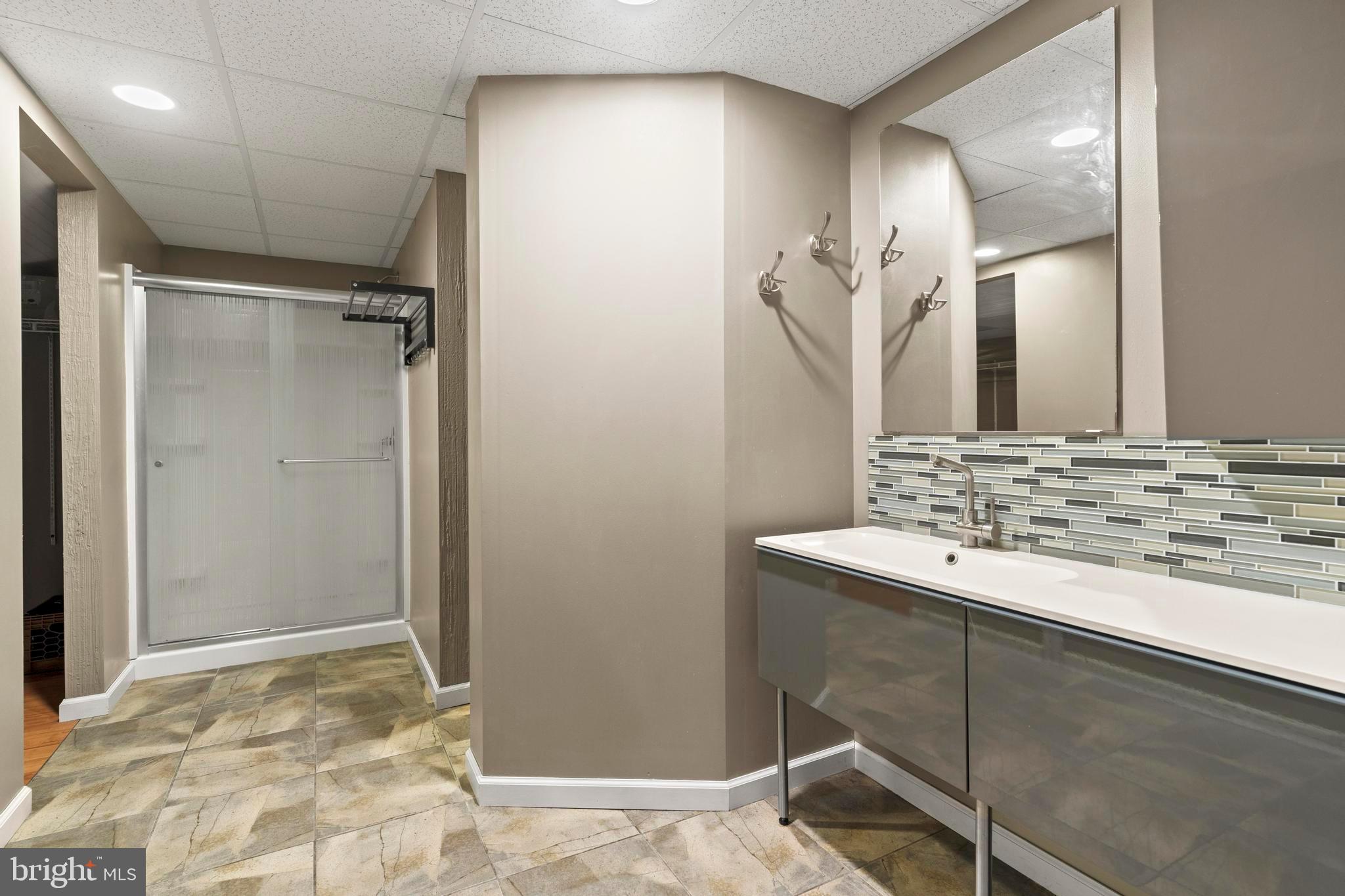 181 Aberdeen Road Williamstown, NJ 08094 - Photo 24 of 29 a bathroom with a sink and a mirror