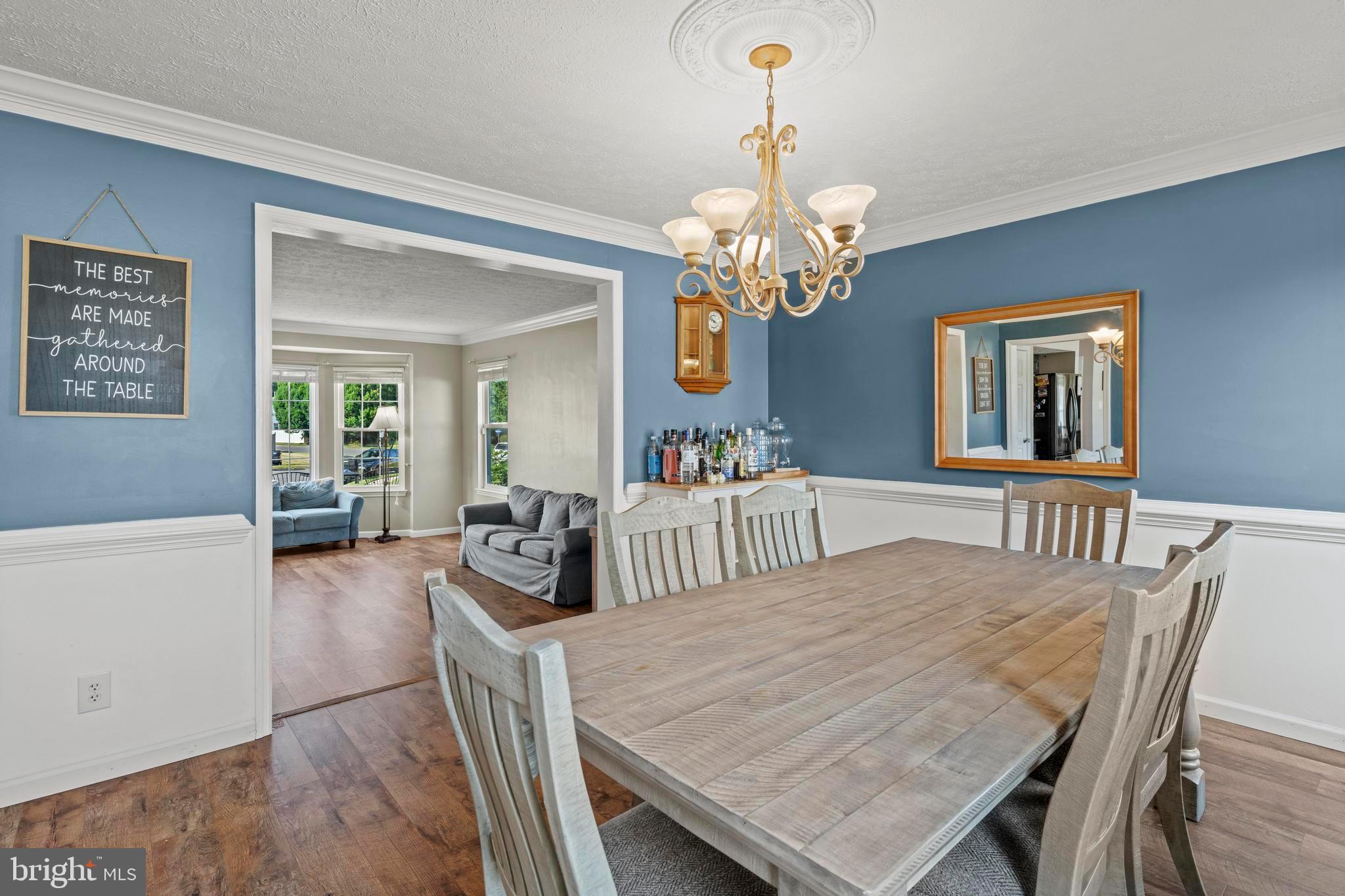 181 Aberdeen Road Williamstown, NJ 08094 - Photo 6 of 29 a view of a dining room with furniture a chandelier and wooden floor