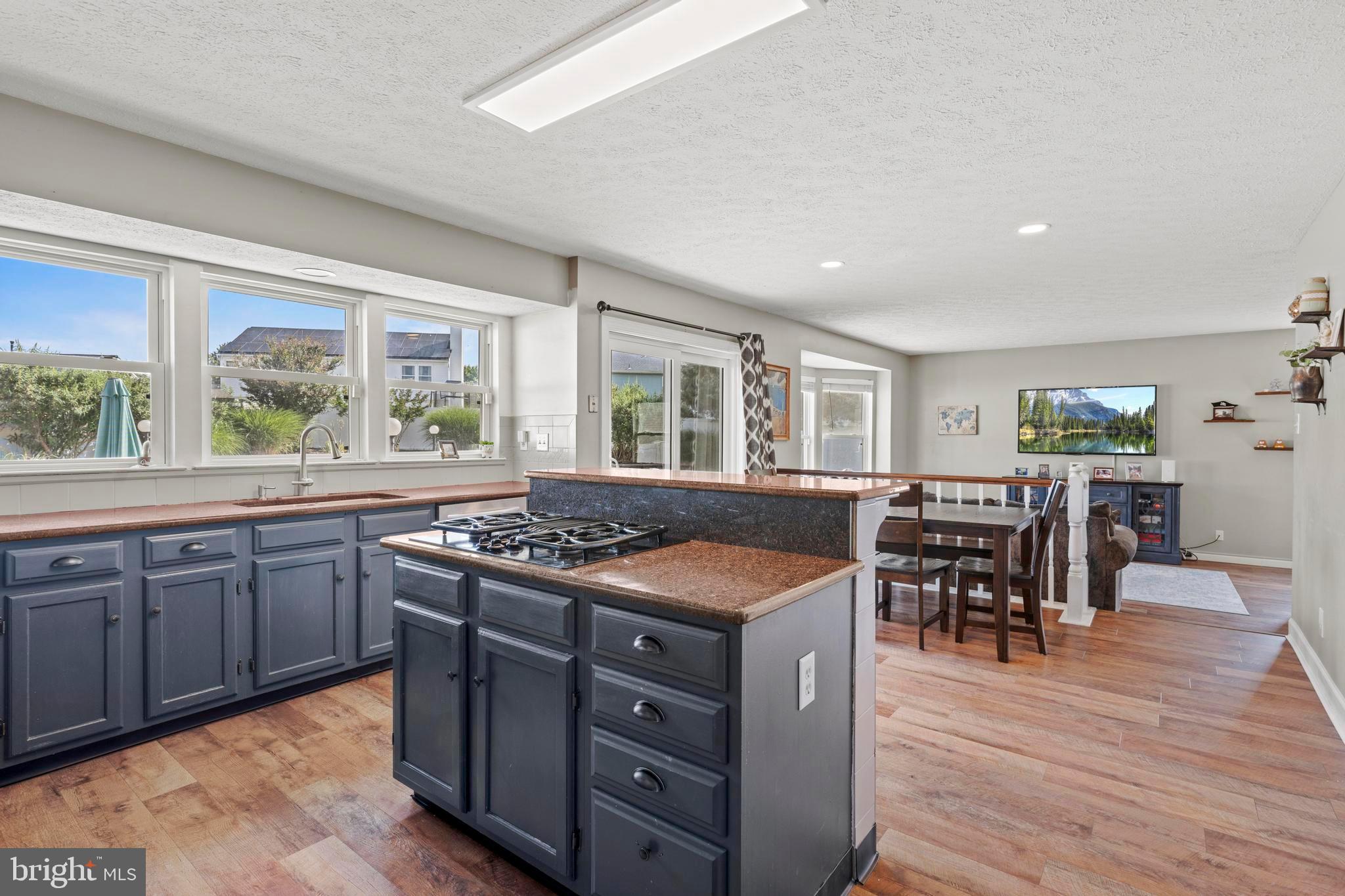181 Aberdeen Road Williamstown, NJ 08094 - Photo 10 of 29 a kitchen with a stove and wooden floor