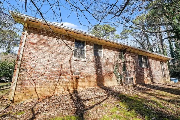 a view of a backyard with wooden fence