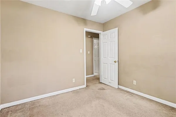 an empty room with a bathroom