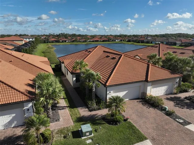 a aerial view of a house with a yard