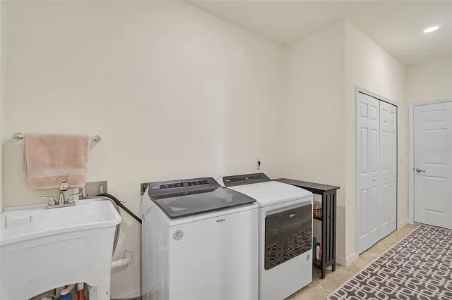 a utility room with dryer and washer