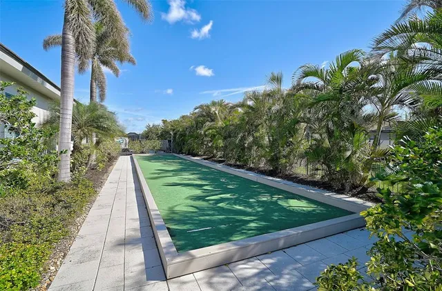 a view of a swimming pool with lounge chair