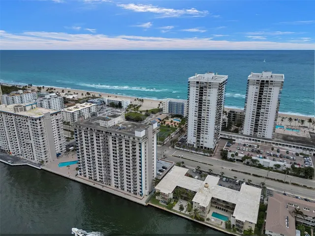a pool table sitting area in front of a room