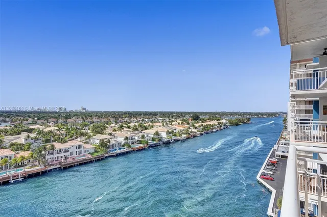 a living room with furniture and a wall painting