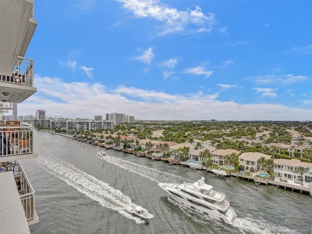 a view of a terrace with lawn chairs