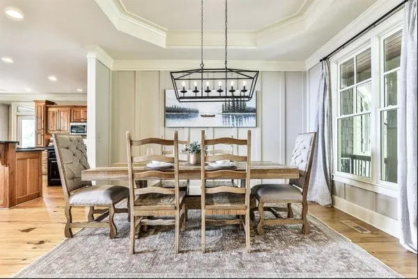 a view of a dining room with furniture window and outside view