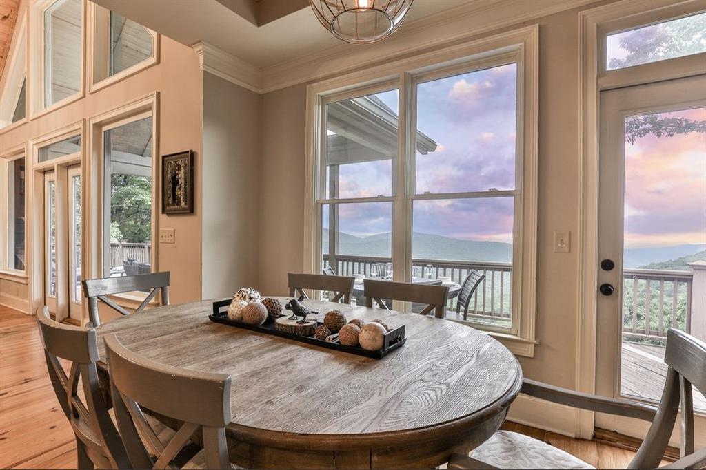 43 Toland Way Big Canoe, GA 30143 - Photo 18 of 50 a view of a dining room with furniture window and wooden floor