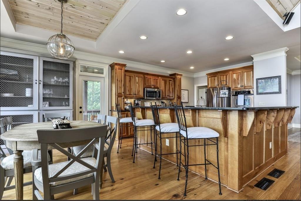 43 Toland Way Big Canoe, GA 30143 - Photo 19 of 50 a view of a dining room with furniture window and outside view