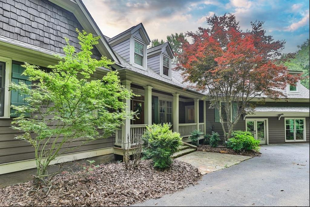 43 Toland Way Big Canoe, GA 30143 - Photo 2 of 50 a front view of a house with garden