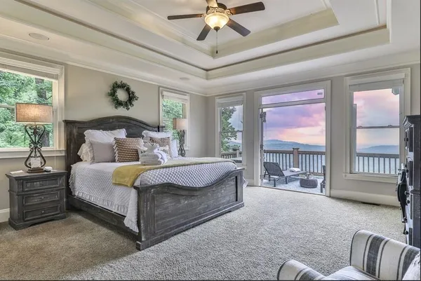 a bed room with a bed and a chandelier
