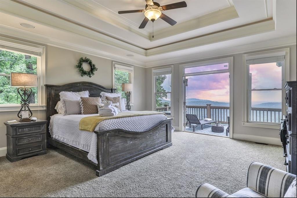 43 Toland Way Big Canoe, GA 30143 - Photo 24 of 50 a bed room with a bed and a chandelier