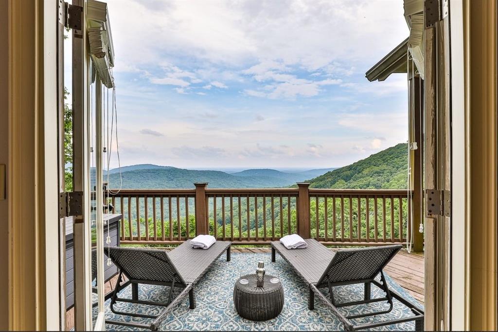 43 Toland Way Big Canoe, GA 30143 - Photo 25 of 50 a roof deck with couch and chairs