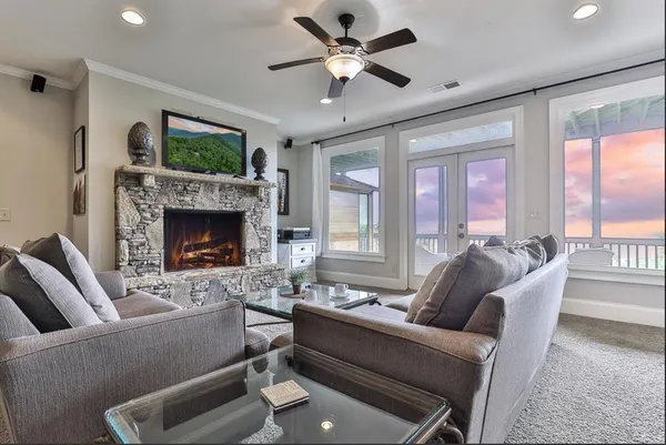 a living room with furniture and a fireplace