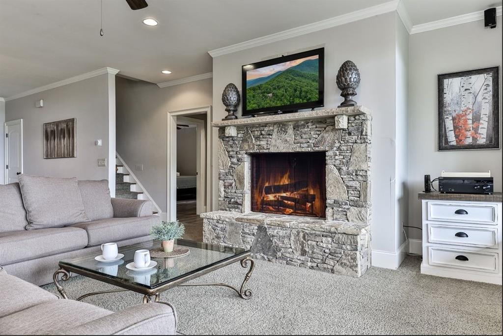 43 Toland Way Big Canoe, GA 30143 - Photo 37 of 50 a living room with furniture and a fireplace