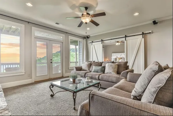 a living room with furniture and a window
