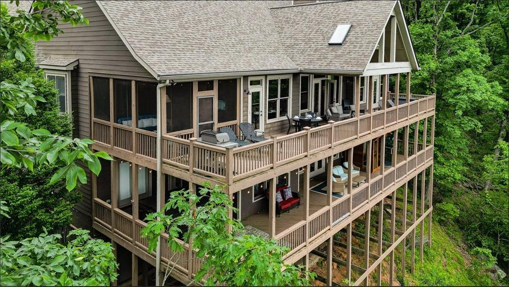 43 Toland Way Big Canoe, GA 30143 - Photo 4 of 50 an aerial view of residential house with deck and plants