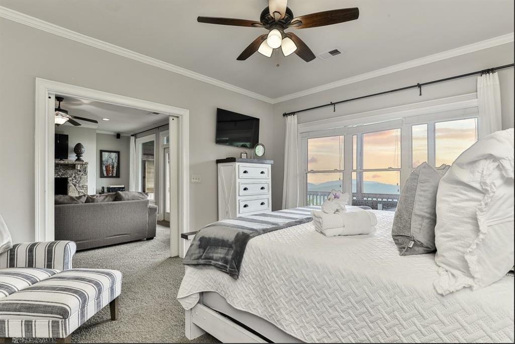 43 Toland Way Big Canoe, GA 30143 - Photo 41 of 50 a bedroom with furniture and a large window