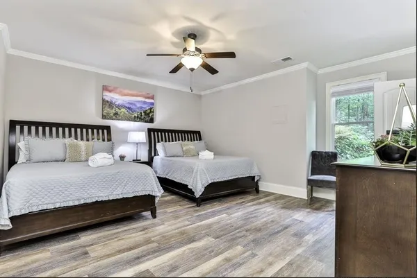 a bedroom with a bed and window