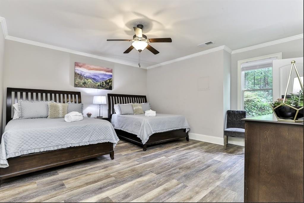 43 Toland Way Big Canoe, GA 30143 - Photo 45 of 50 a bedroom with a bed and window