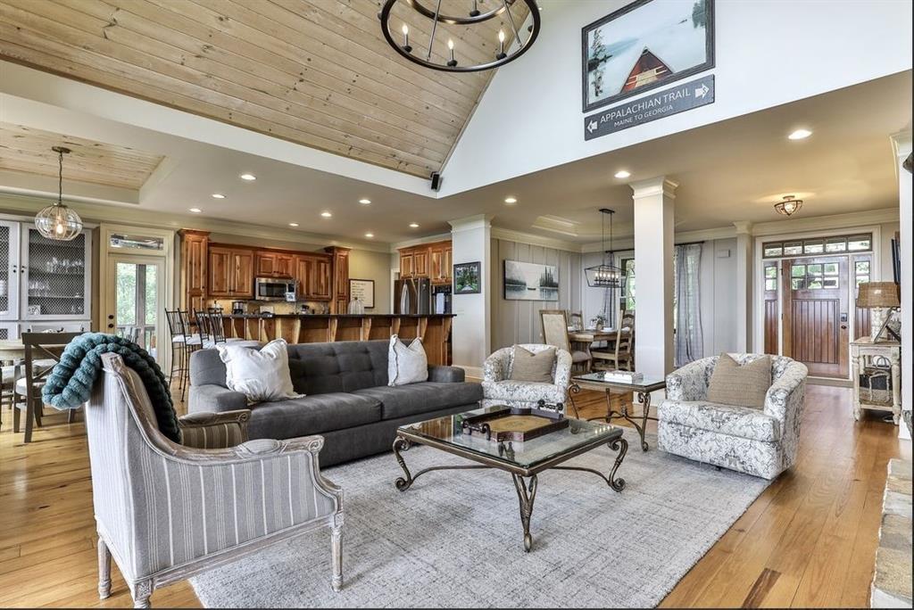 43 Toland Way Big Canoe, GA 30143 - Photo 9 of 50 a living room with furniture and a wooden floor
