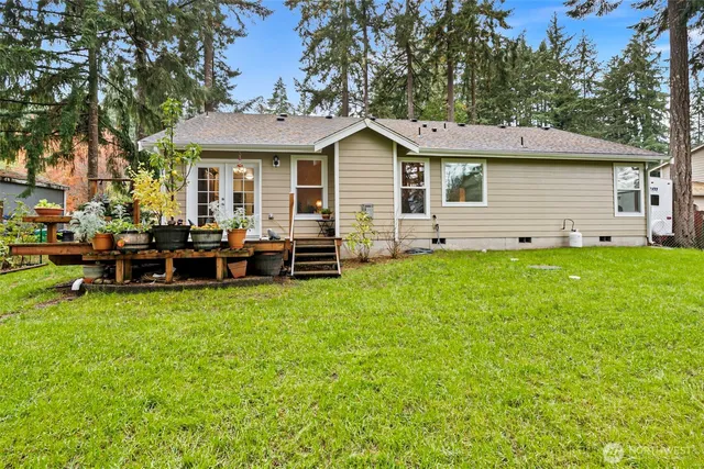 a view of a house with a yard porch and sitting area
