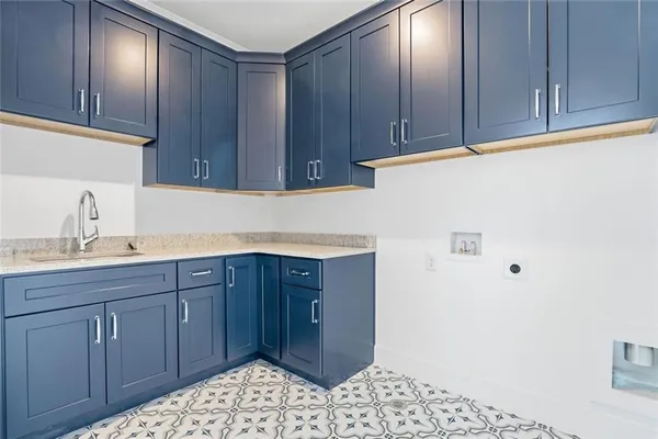 a bathroom with a granite countertop toilet a sink and a bathtub