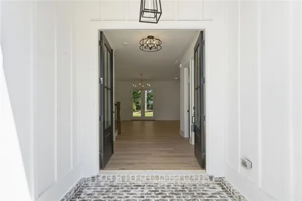a view of a room with shelves on the wall