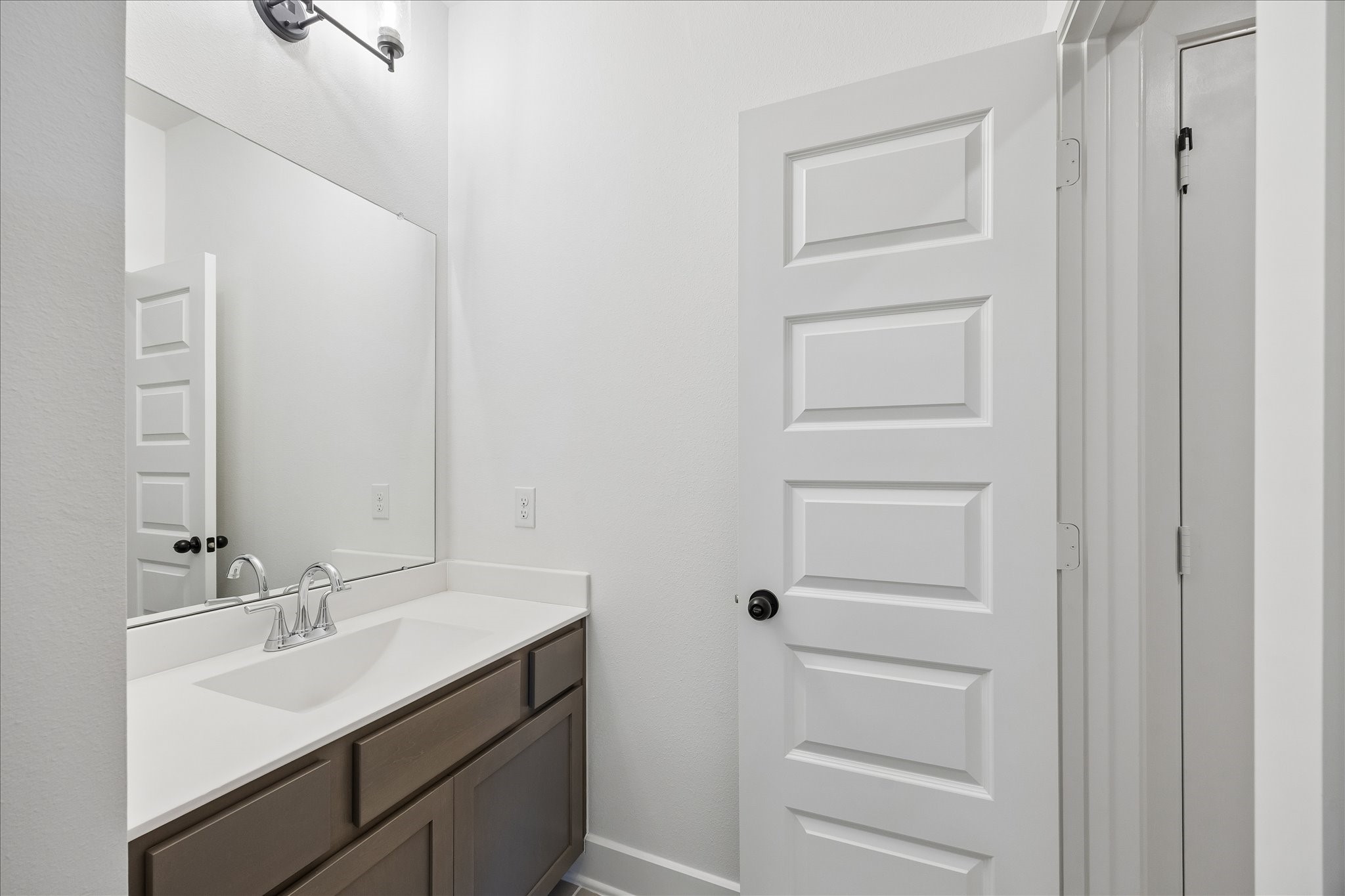 4814 Highland Strm Court Fulshear, TX 77441 - Photo 27 of 34 a bathroom with a sink vanity and a mirror