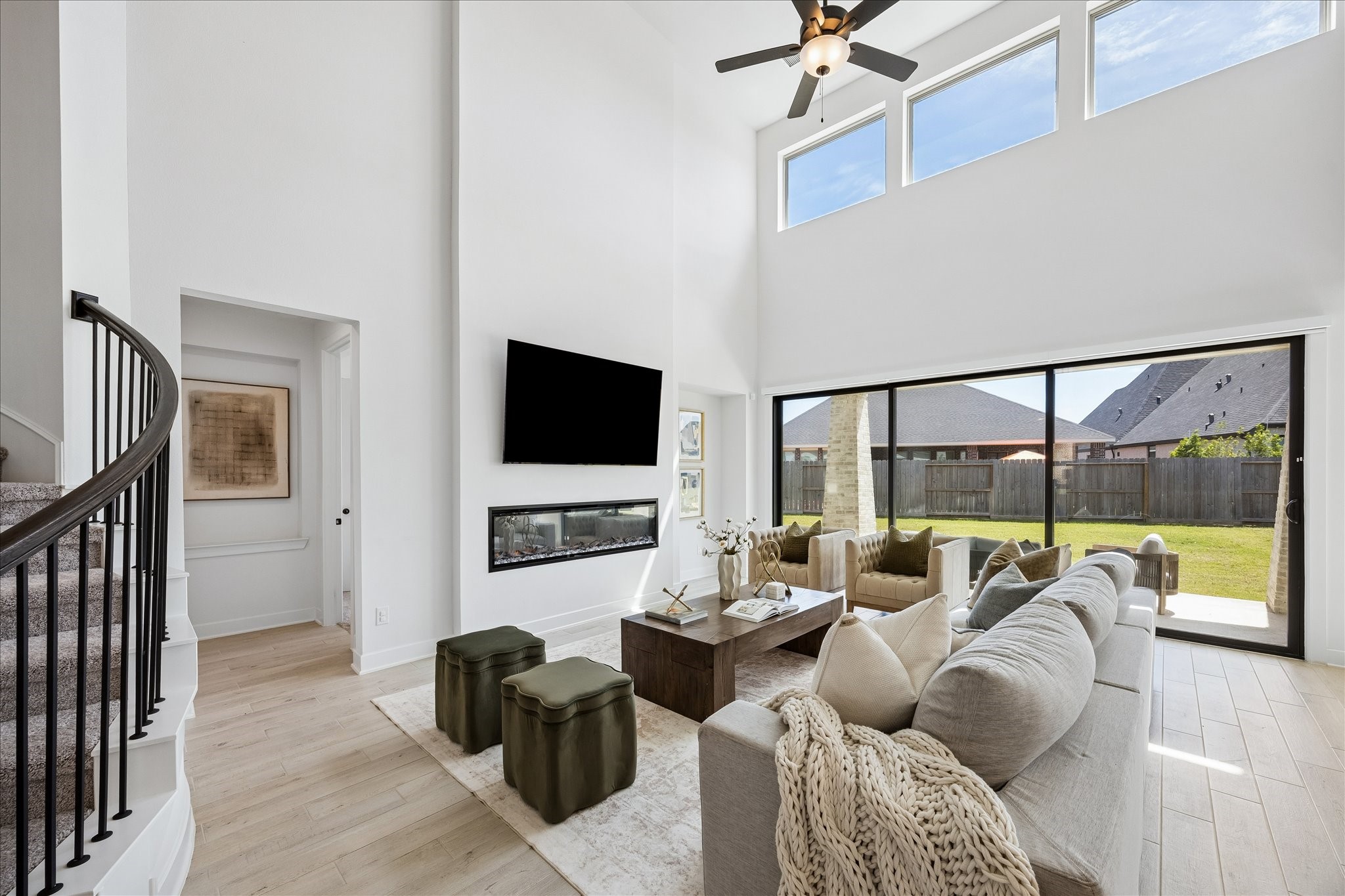 4814 Highland Strm Court Fulshear, TX 77441 - Photo 4 of 34 a living room with furniture and a flat screen tv